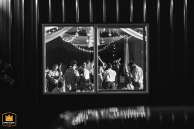In Hood River, Oregon, guests are seen dancing the night away through a window, captured from outside the reception site. 